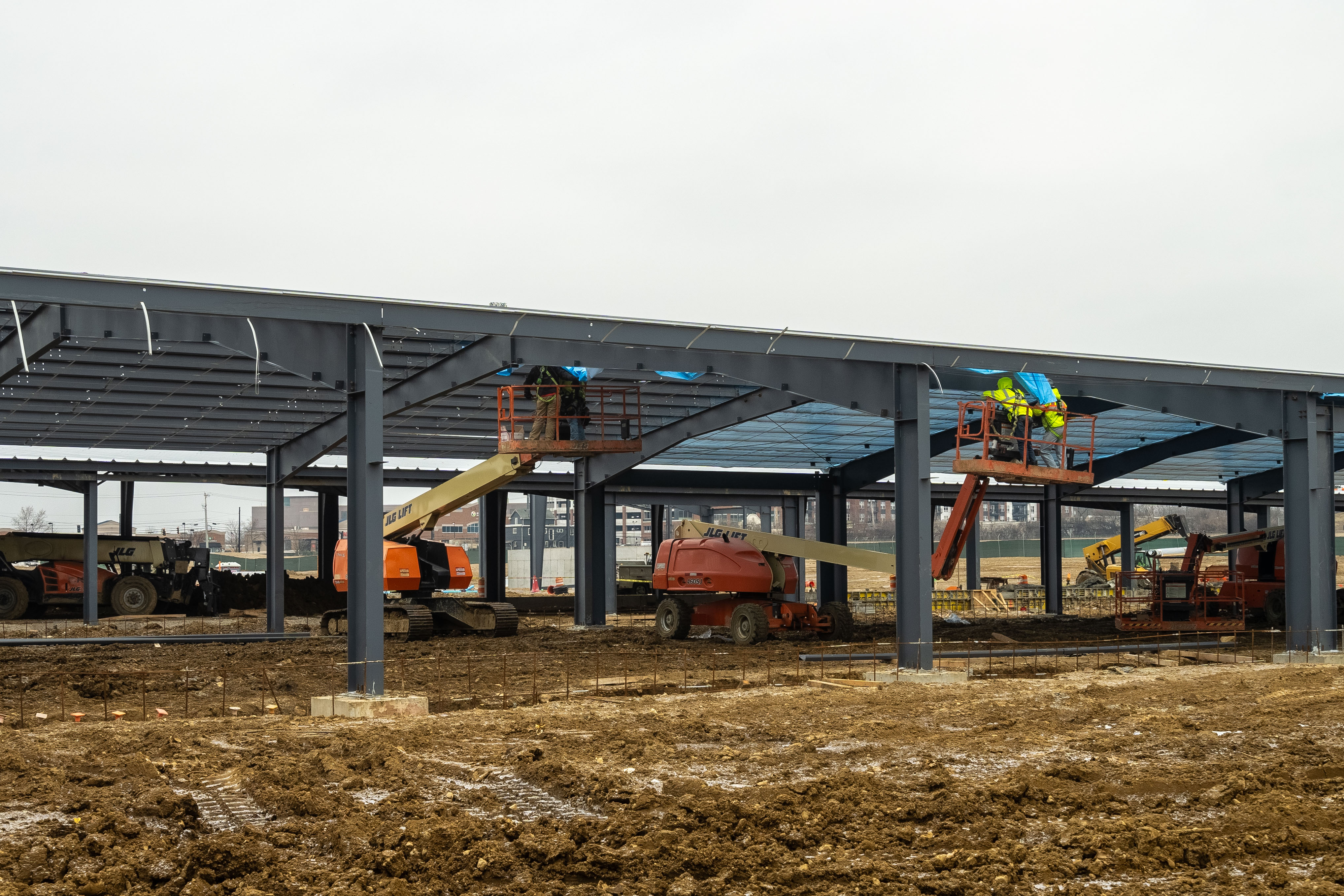 A view of crews working to install framing.