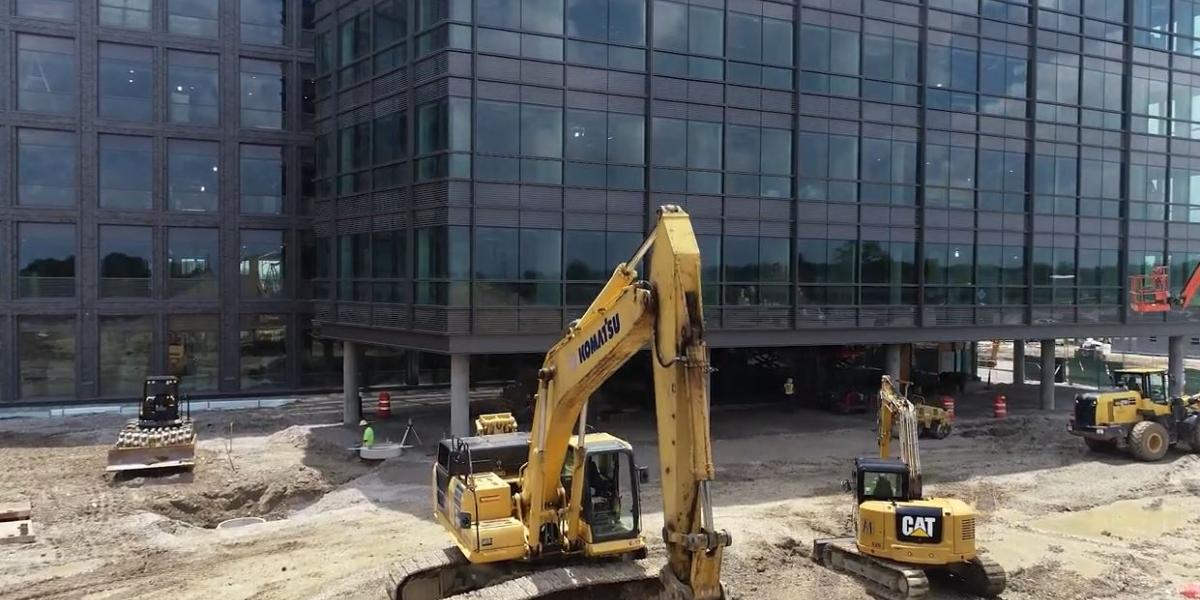 A view of IRF construction with escavator in foreground