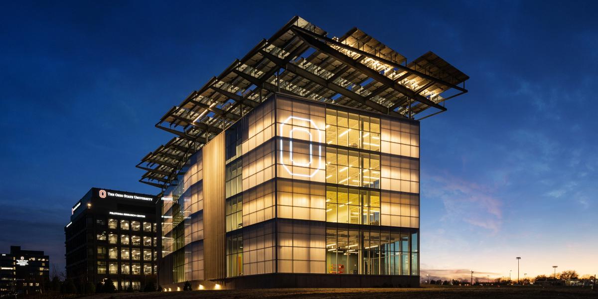 The EAIC seen at night with a lit up "block O" seen on the exterior.