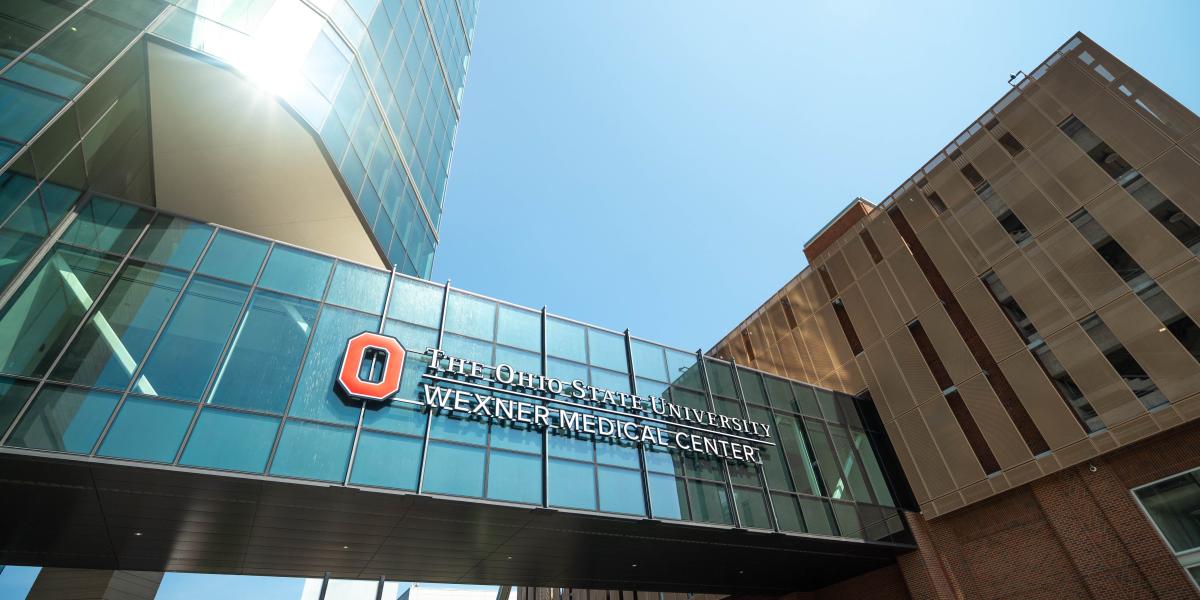 A view of a large sign on a walkway that reads, "The Ohio State University Wexner Medical Center"